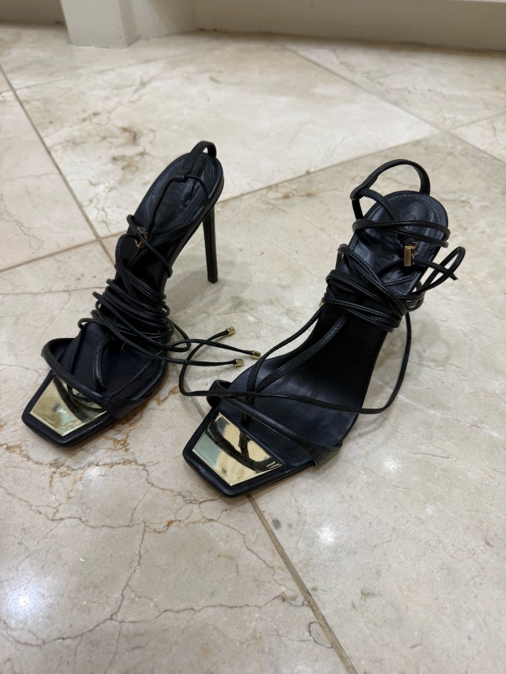 SCHUTZ Black Lace-Up Stiletto Sandals with Gold Toe Accent